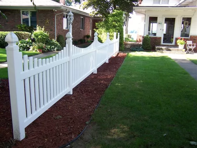 scalloped picket white fencing